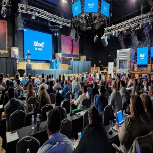 Corporate seminar with presentation screens and audience at Imagen Venues Houston