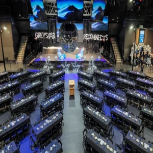 Corporate awards setup with stage, classroom seating, and AV at Imagen Venues