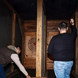 Guests enjoying axe throwing at Imagen Venues, a turn-key corporate event venue in Houston