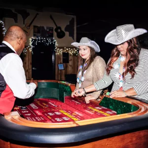 Guests playing at the casino table during a corporate event at Imagen Venues in Houston