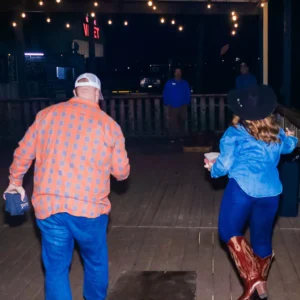 Guests playing cornhole at Imagen Venues, a turn-key corporate event venue in Houston