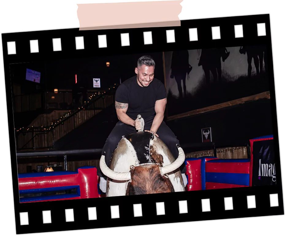 Person enjoying the mechanical bull activity at Imagen Venues Houston