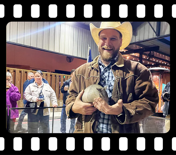 Guests holding armadillos before the race at Imagen Venues Houston