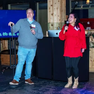 Guests singing karaoke at Imagen Venues, a turn-key corporate event venue in Houston