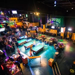 Aerial view of pool tables area at Stampede inside Imagen Venues corporate event venue in Houston