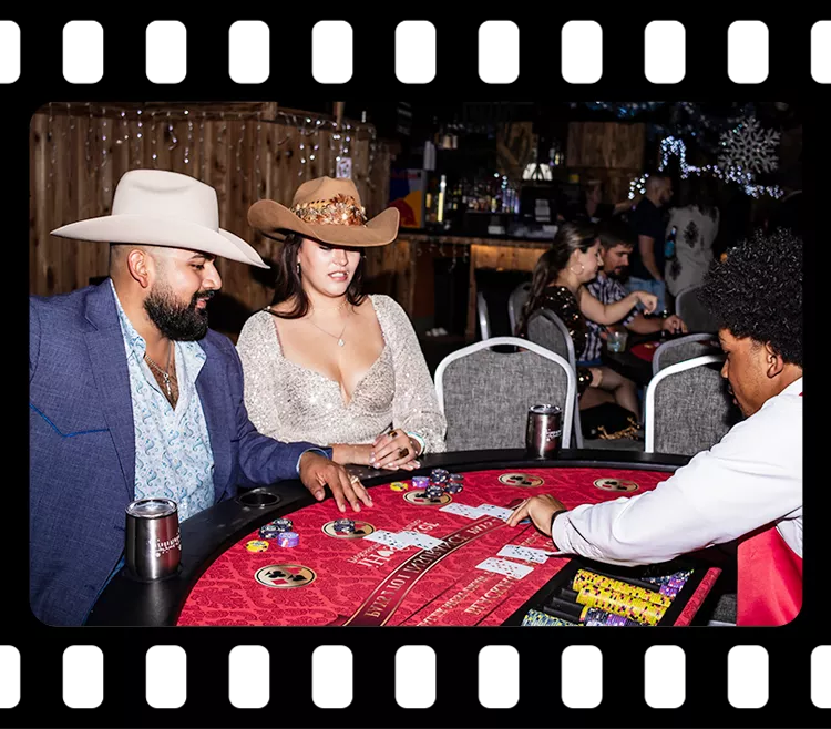 Guests playing blackjack with a dealer during a casino-themed corporate event at Imagen Venues Houston