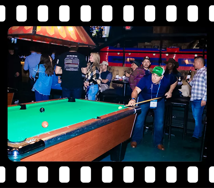 Guests participating in a pool game during a corporate event inside the entertainment area at Imagen Venues Houston